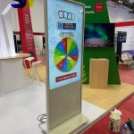 Interactive game wheel stand at promotional booth